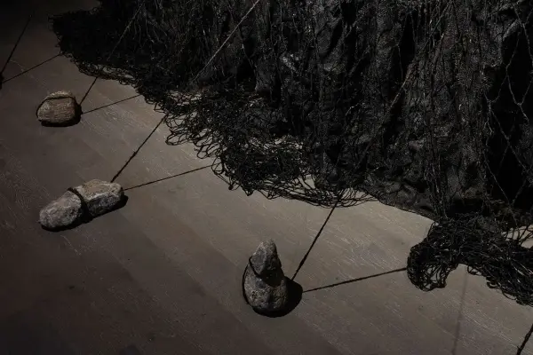 Nicole Collins, Apeiron, 2018 (installation detail 2), microcrystalline wax, charcoal, burlap, jute, coir, stone, dimensions variable. Photo: Toni Hafkenscheid.