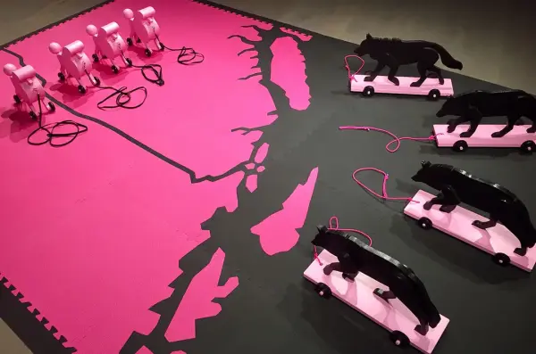 Mary Anne Barkhouse, Red Rover (detail) 2012. Floor installation with rubber mats, painted wooden cutouts, with pull cords and wooden wheels. 259.1 x 320 x 35.6 cm.