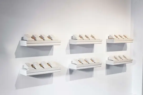 Clint Neufeld, Bucket Teeth on Shelves, details 2, 2006, porcelain, MDF, 6” x 20” x 7”. Photo: Toni Hafkenscheid.