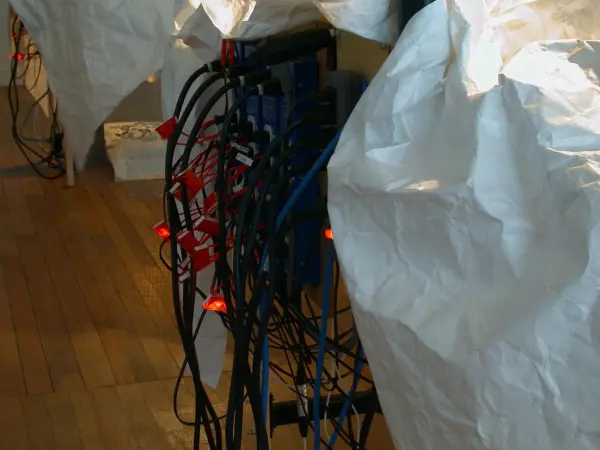 Diane Landry, The Magic Shield (detail 4), 2005, installation with automation, 2 futon-frame-beds, motors, selected objects, aluminum, wood, halogen lamp, MIDI controller, computer. Courtesy of the artist.